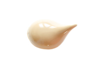 Beige makeup smear of creamy foundation isolated on white background. The concept of fashion and beauty industry. - Image
