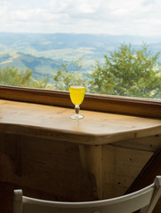 Tea on the background of an open window with mountain views