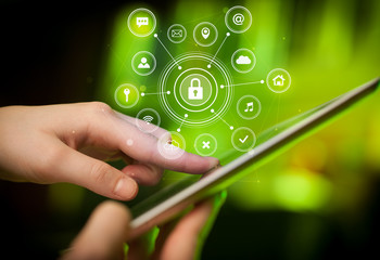 Hand holding tablet with online security concept