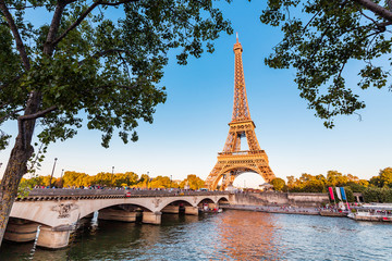 Panoramic view of Eiffel tower and Seine river at golden sunset. Travel landmarks in Europe and...