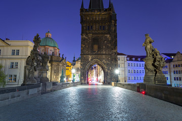 Beautiful gate to the Charles bridge in Prague at night, Czech Republic