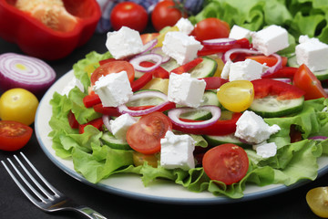 A plate full of bright fresh vegetable salad