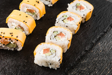 Delicious rolls with fish and cheese	