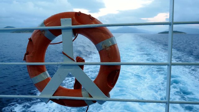 Life belt or life buoy on the ship floating the Mediterranean sea. Greece. 4K