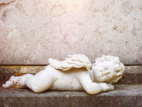 sleeping angel grave statue