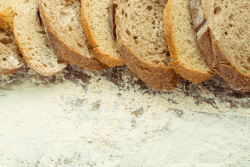 Sliced loaf of different kind homemade bread.