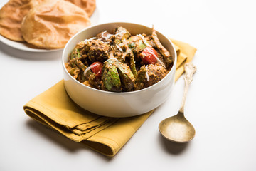 Undhiyu is a Gujarati mixed vegetable dish, specialty of Surat, India. Served in a bowl with or without poori