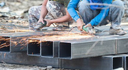 Workers are working to polish steel
