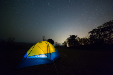 Fototapeta na wymiar Night camping at mountain 