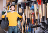 Ordinary guy deciding on best shovel
