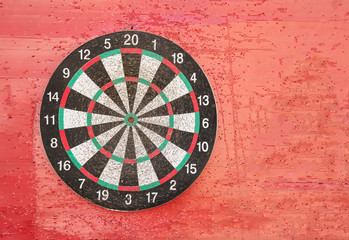Old Darts on red futures board background