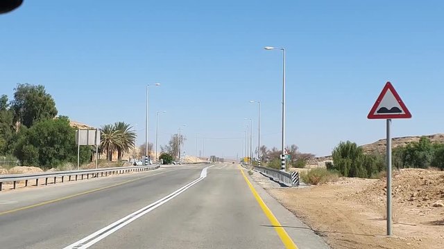 Driving along road in Southern Israel passing sign to Be'er Sheva