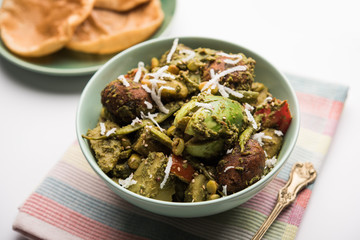 Undhiyu is a Gujarati mixed vegetable dish, specialty of Surat, India. Served in a bowl with or without poori