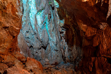 Natural high mountain cave, Mrozna cave in Tatras, yellow and brown rocks 