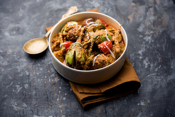 Undhiyu is a Gujarati mixed vegetable dish, specialty of Surat, India. Served in a bowl with or without poori