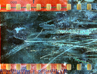 Blank grained and scratched film strip texture background.  old film effect