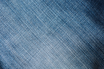 Naklejka premium Texture of blue jeans background