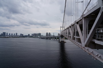 Fototapeta premium Tokyo Rainbow bridge under the cloudy sky