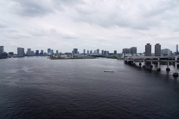 Fototapeta na wymiar Tokyo Rainbow bridge under the cloudy sky