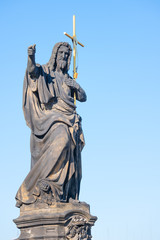 Fototapeta premium Statue of St. John Baptist. By Josef Max On the Carlo Bridge in Prague