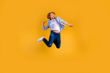 Fototapeta na wymiar Full body photo of crazy redhead guy jumping high making slam dunk trick best basketball team player final cup game wear casual outfit isolated yellow background