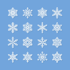Snowflake flat icons set. Collection of cute geometric stylized snowfall. Design element for christmas or new year card, winter ornament. Frozen white snow silhouette on blue background