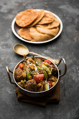 Undhiyu is a Gujarati mixed vegetable dish, specialty of Surat, India. Served in a bowl with or without poori