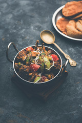 Undhiyu is a Gujarati mixed vegetable dish, specialty of Surat, India. Served in a bowl with or without poori