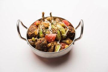 Undhiyu is a Gujarati mixed vegetable dish, specialty of Surat, India. Served in a bowl with or without poori