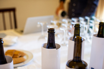 blind wine tasting with wine bottles 