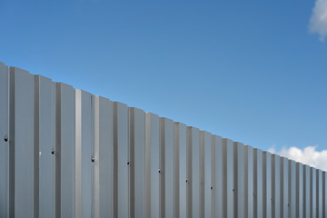 Metal fence against the sky