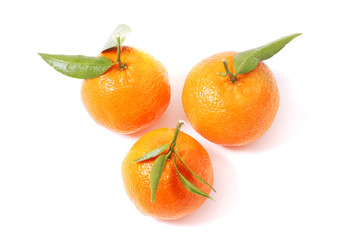 Mandarin with green leaf isolated on white background.