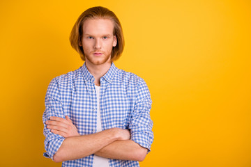 Photo of confident serious intelligent business guy standing with hands folded wearing white t-shirt staring candidly isolated vibrant color background