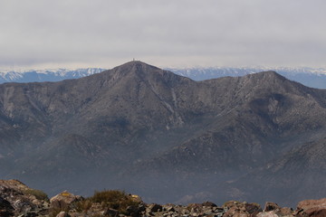 mountains view with clouds and mist from a peak