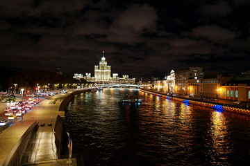 Fototapeta na wymiar Moscow's Kotelnicheskaya Embankment Building at night, Moscow river.