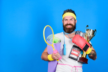 Motivated athlete guy. Gym instructor. Athlete on way to healthier body. Healthy habits. Sportsman training blue background. Athlete training with sport equipment. Man bearded athlete exercising