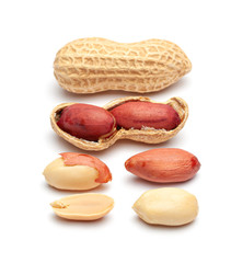 Dried peanuts in peel closeup isolated on white background