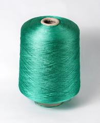 bobbin of yarn on a white background. Side view.Textile reel on isolated white background.