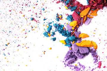 Macro texture Broken eye shadow multi-colored powder, isolated on white background