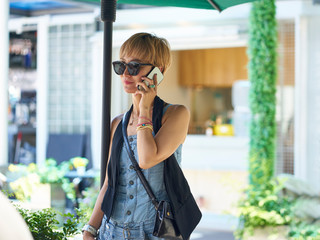 asian woman talking using mobile phone