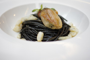 Green lipped mussels on squid ink pasta