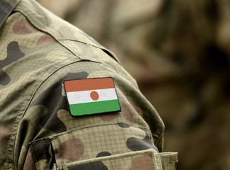Flag of Niger on military uniforms (collage). Army,soldiers, Africa (collage). - obrazy, fototapety, plakaty
