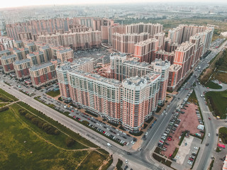 New block of modern apartments  and blue sky in the background.