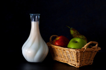 ASKET WITH FRUIT AND MILK BOTTLE ON DARK FUND