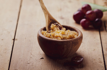 Ingredients for body scrub of brown sugar with grape and  oil, eco bio friendly cosmetic for skin care.