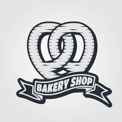 Bakery or bread shop logo, emblem in vintage style with Pretzel. Vector illustration