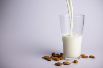 pouring milk into glass. Healthy eating concept