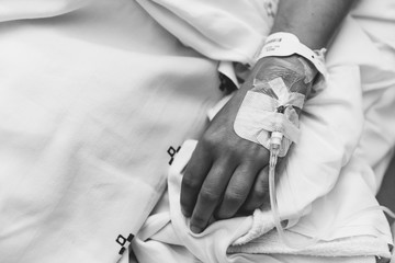 Dropper supplying medication to a newly operated patient in the hospital.