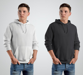 Mockup white and black hoodie on a young guy.