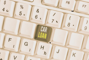 Word writing text Car Loan. Business photo showcasing taking money from bank with big interest to buy new vehicle White pc keyboard with empty note paper above white background key copy space
